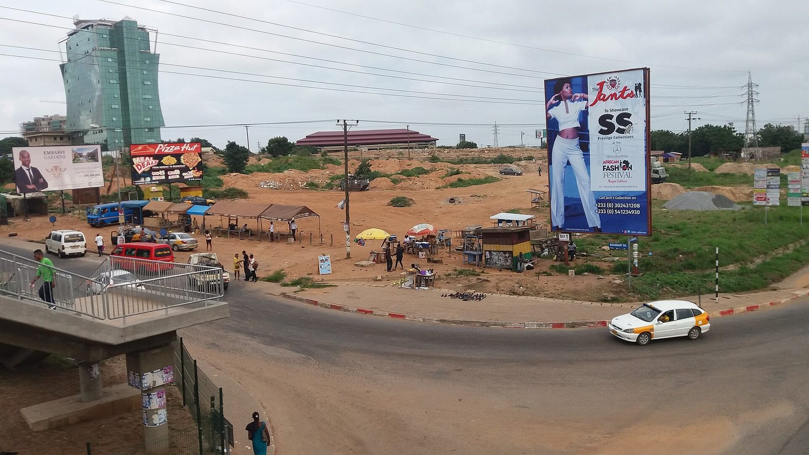 A road and buildings in the East Legon area of Accra, Ghana, a neighbourhood favoured by diaspora returnees looking for housing